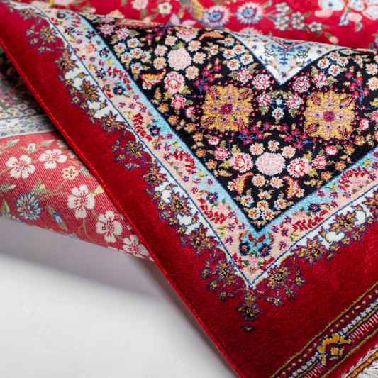 Arden silk rug in 150x100 cm with beige base, bird and floral motifs, and intricate multicolor detailing.