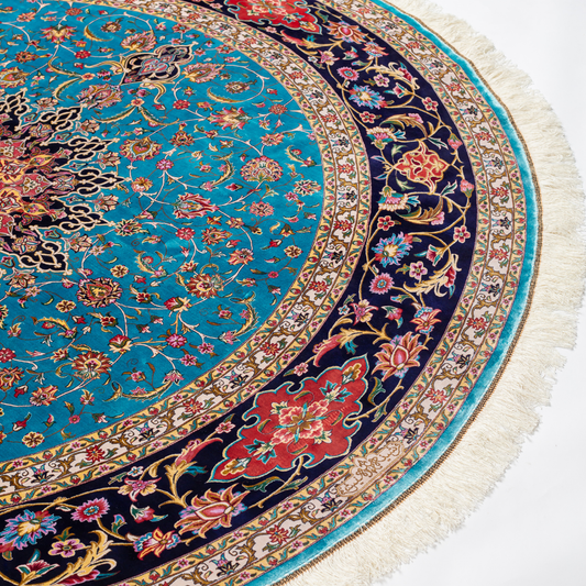 Cello Silk Rug with a turquoise base, intricate central floral medallion, and ornate navy border with Persian floral motifs and fine silk texture.