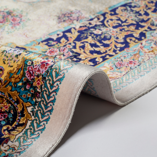 Close-up of the Drais silk rug showing intricate floral patterns, soft sheen and detailed design.