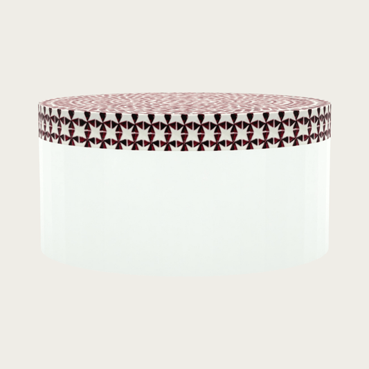 Round red bone inlay coffee table featuring a vibrant mosaic pattern on the top and sides. Perfect for modern and eclectic interiors.