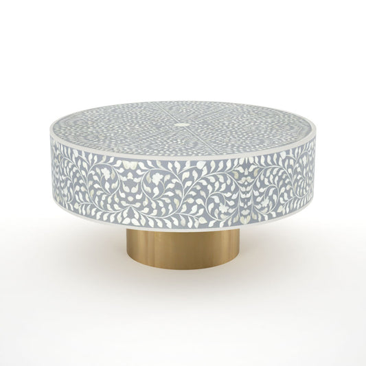 Round grey bone inlay coffee table with floral design and a gold base