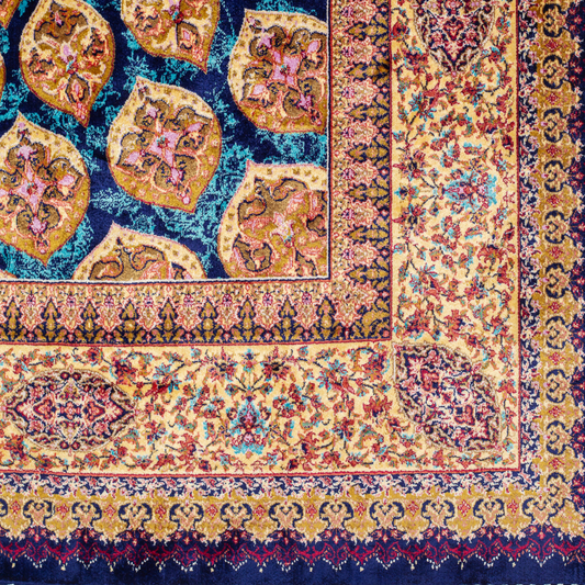 Tobe silk rug featuring a medallion and floral design in navy, ruby, teal, and ivory. Size: 150x100 cms.