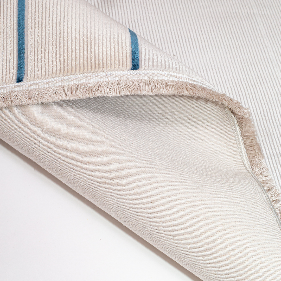 Victor cotton Rug in 200x300 cm featuring beige and ivory tones with minimal blue line and circle design, made from soft silk blend.