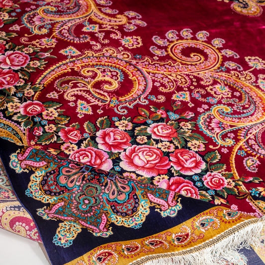 Zane Silk Rug with crimson red base, floral medallion pattern, intricate gold scrolls, and a navy border, crafted in fine silk with detailed motifs.