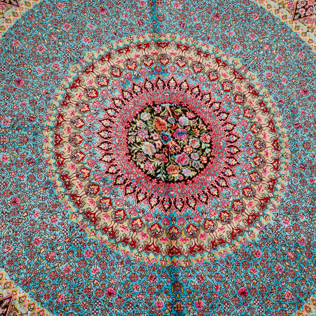 Elegant ivory silk rug featuring pastel floral medallion, delicate vines, and a golden glow. Handwoven to perfection with luxurious texture.

