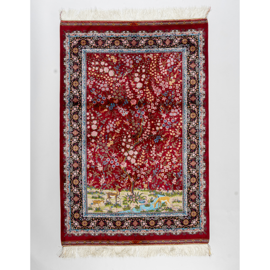 Arden silk rug in 150x100 cm with beige base, bird and floral motifs, and intricate multicolor detailing.