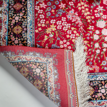 Arden silk rug in 150x100 cm with beige base, bird and floral motifs, and intricate multicolor detailing.