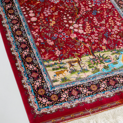 Arden silk rug in 150x100 cm with beige base, bird and floral motifs, and intricate multicolor detailing.