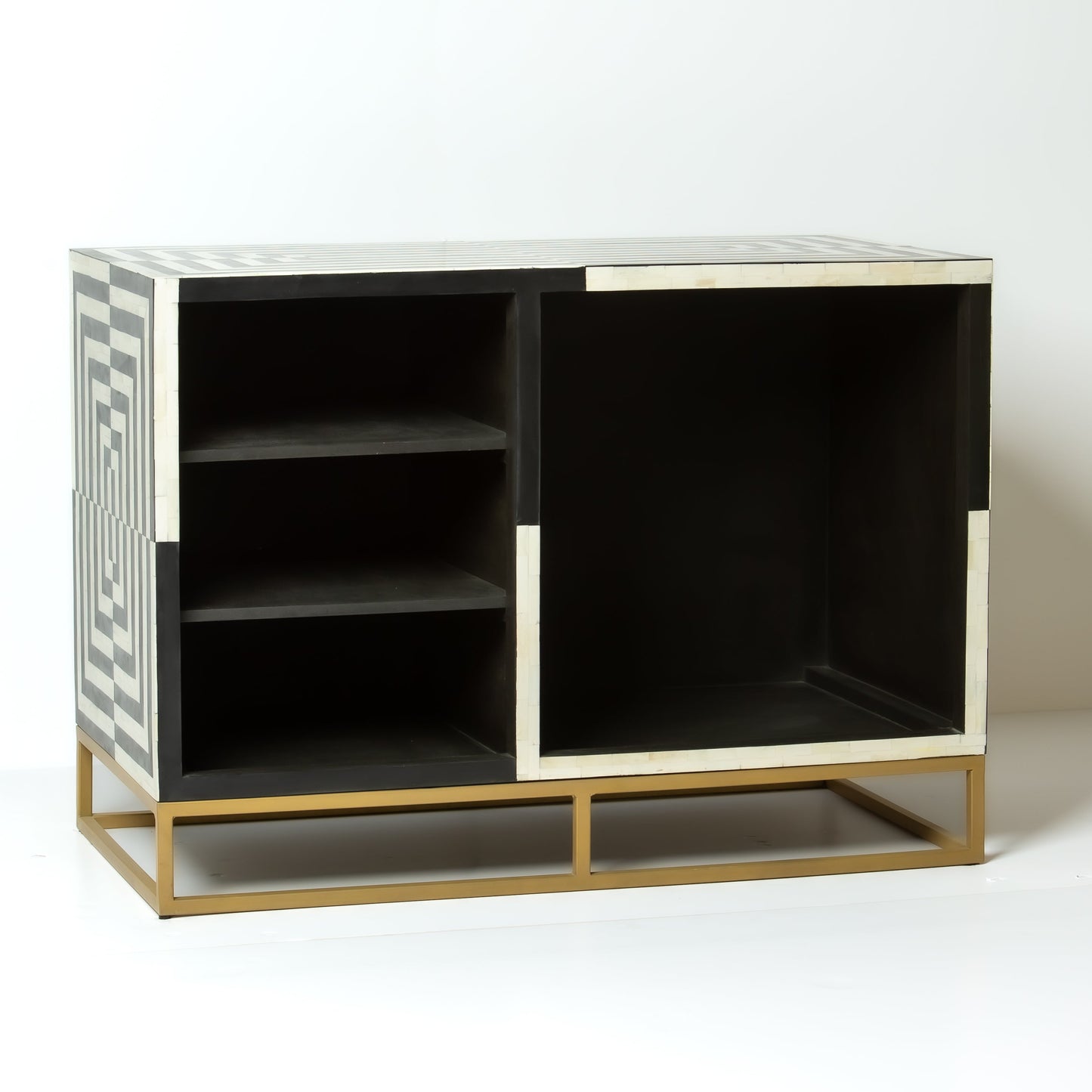 Black bone inlay bar cabinet with bold geometric front and open back storage, handmade with brass base and striking design.
