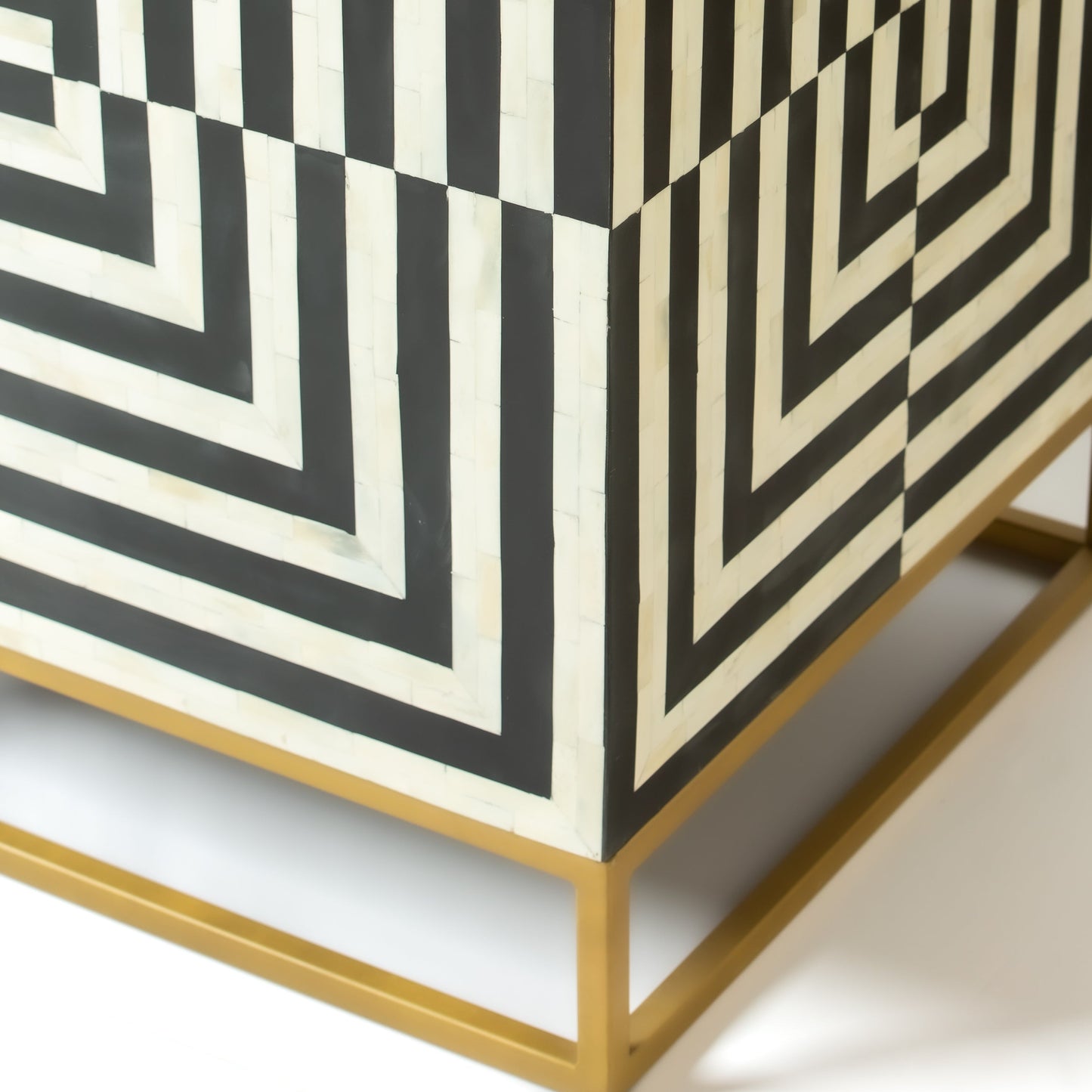 Black bone inlay bar cabinet with bold geometric front and open back storage, handmade with brass base and striking design.
