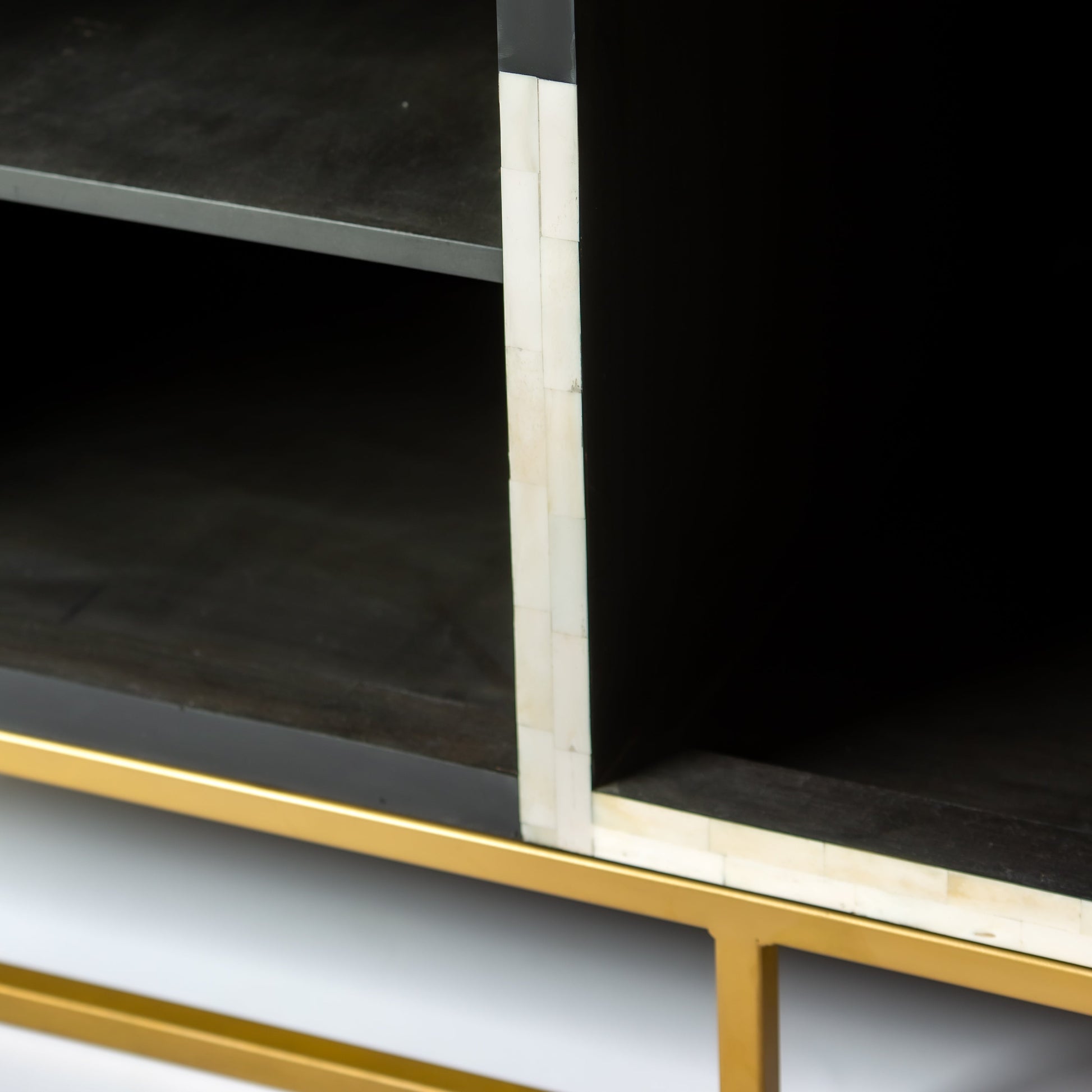 Black bone inlay bar cabinet with bold geometric front and open back storage, handmade with brass base and striking design.
