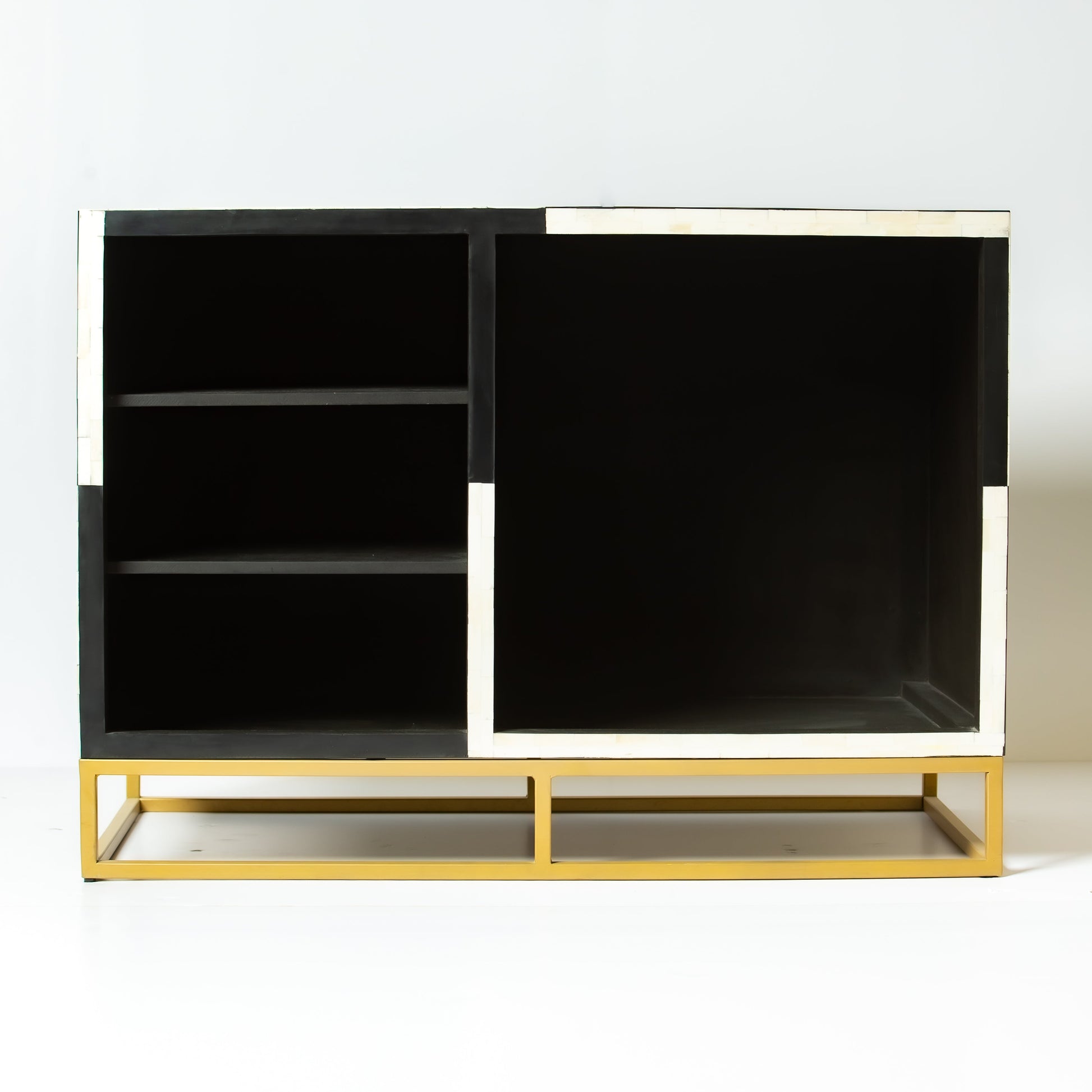 Black bone inlay bar cabinet with bold geometric front and open back storage, handmade with brass base and striking design.
