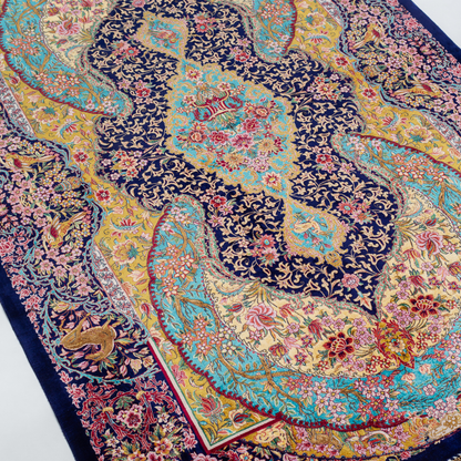Belaw Silk Rug featuring navy base with gold vines, teal medallions, and pink floral detailing, 150x100 cm.