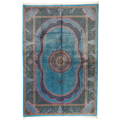 Luxurious silk rug in turquoise with intricate medallion and floral patterns, perfect for refined interiors.