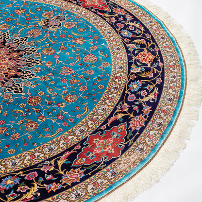 Cello Silk Rug with a turquoise base, intricate central floral medallion, and ornate navy border with Persian floral motifs and fine silk texture.