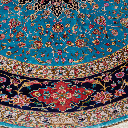 Cello Silk Rug with a turquoise base, intricate central floral medallion, and ornate navy border with Persian floral motifs and fine silk texture.