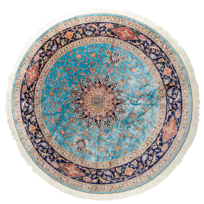 Cello Silk Rug with a turquoise base, intricate central floral medallion, and ornate navy border with Persian floral motifs and fine silk texture.