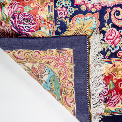 Silk rug with tree of life and bird motif, burgundy floral base, and ornate navy-gold borders. Handwoven with artistic precision.

