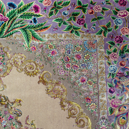 Elegant silk rug with peacock and floral design in soft pastels. Framed by intricate vine borders. A handwoven masterpiece of grace.

