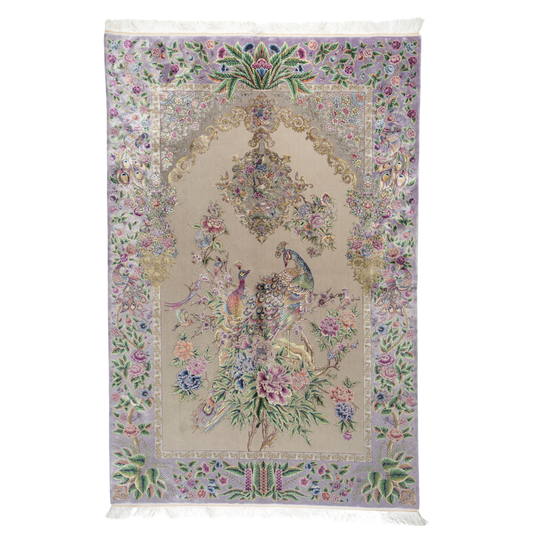Elegant silk rug with peacock and floral design in soft pastels. Framed by intricate vine borders. A handwoven masterpiece of grace.

