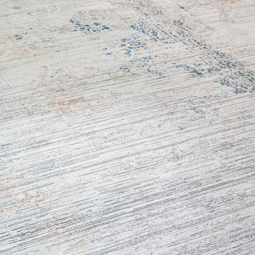 Core Cotton rug in 400x300 cm featuring muted tones of grey, ivory, blue, and burnt orange in a softly distressed modern texture.