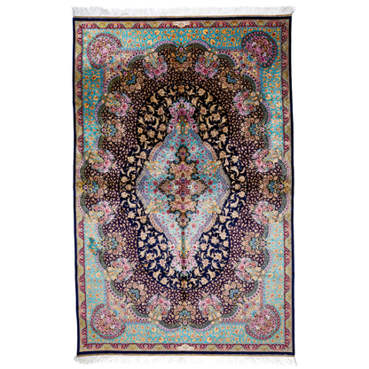 Luxurious silk rug with intricate medallion and floral design in jewel tones. Elegant handwoven detailing for sophisticated interiors.

