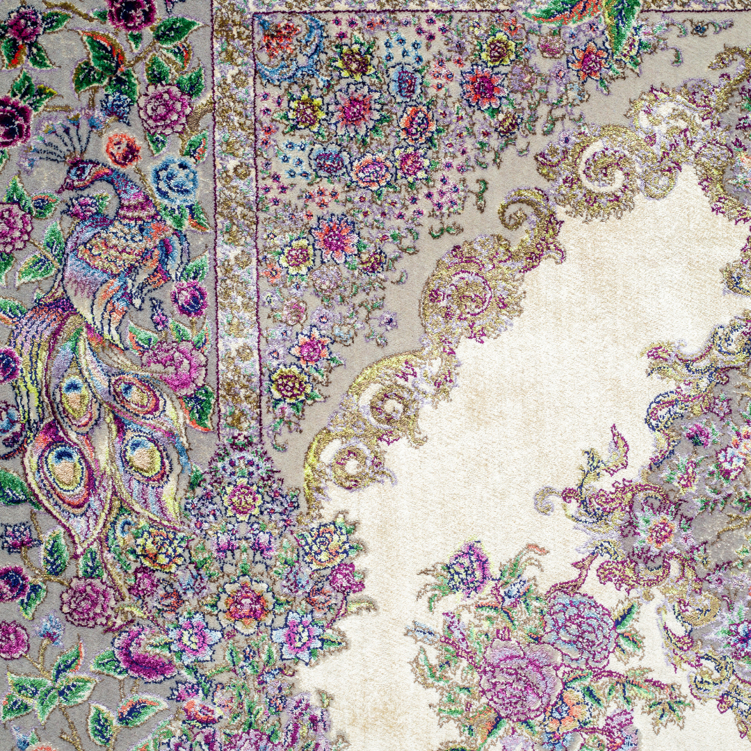 Luxurious ivory silk rug featuring peacocks, floral motifs, and intricate detailing, handcrafted with multicolored threads.