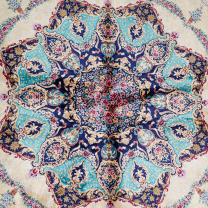 Close-up of the Drais silk rug showing intricate floral patterns, soft sheen and detailed design.