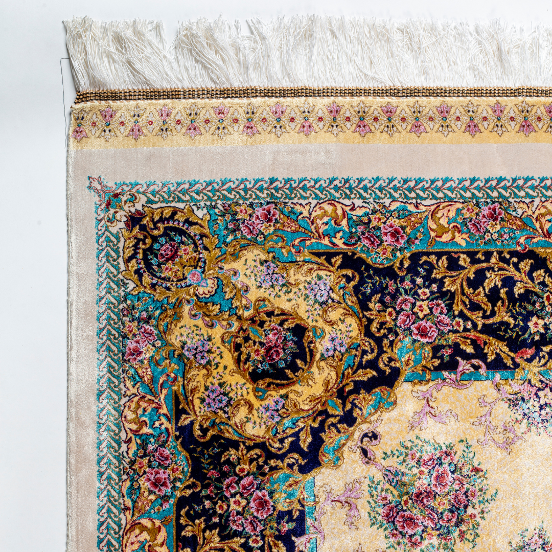 Close-up of the Drais silk rug showing intricate floral patterns, soft sheen and detailed design.