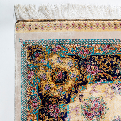 Close-up of the Drais silk rug showing intricate floral patterns, soft sheen and detailed design.