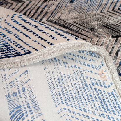 Eclipse cotton rug featuring a bold chevron pattern in grey, blue, and ivory with a distressed texture, perfect for contemporary interiors.