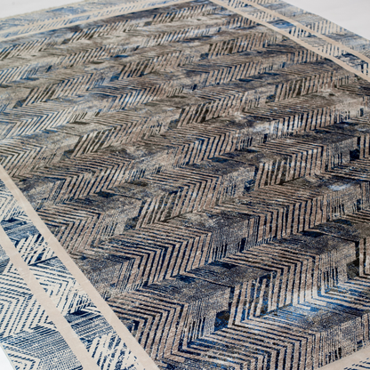 Eclipse cotton rug featuring a bold chevron pattern in grey, blue, and ivory with a distressed texture, perfect for contemporary interiors.