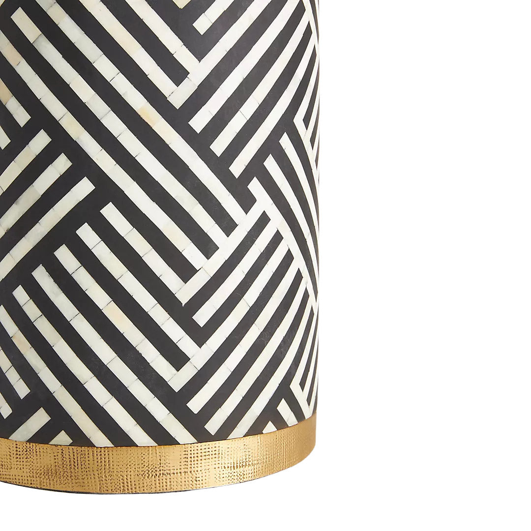 Black bone inlay side table with bold striped pattern, handcrafted with a brass base accent, ideal for modern interiors.