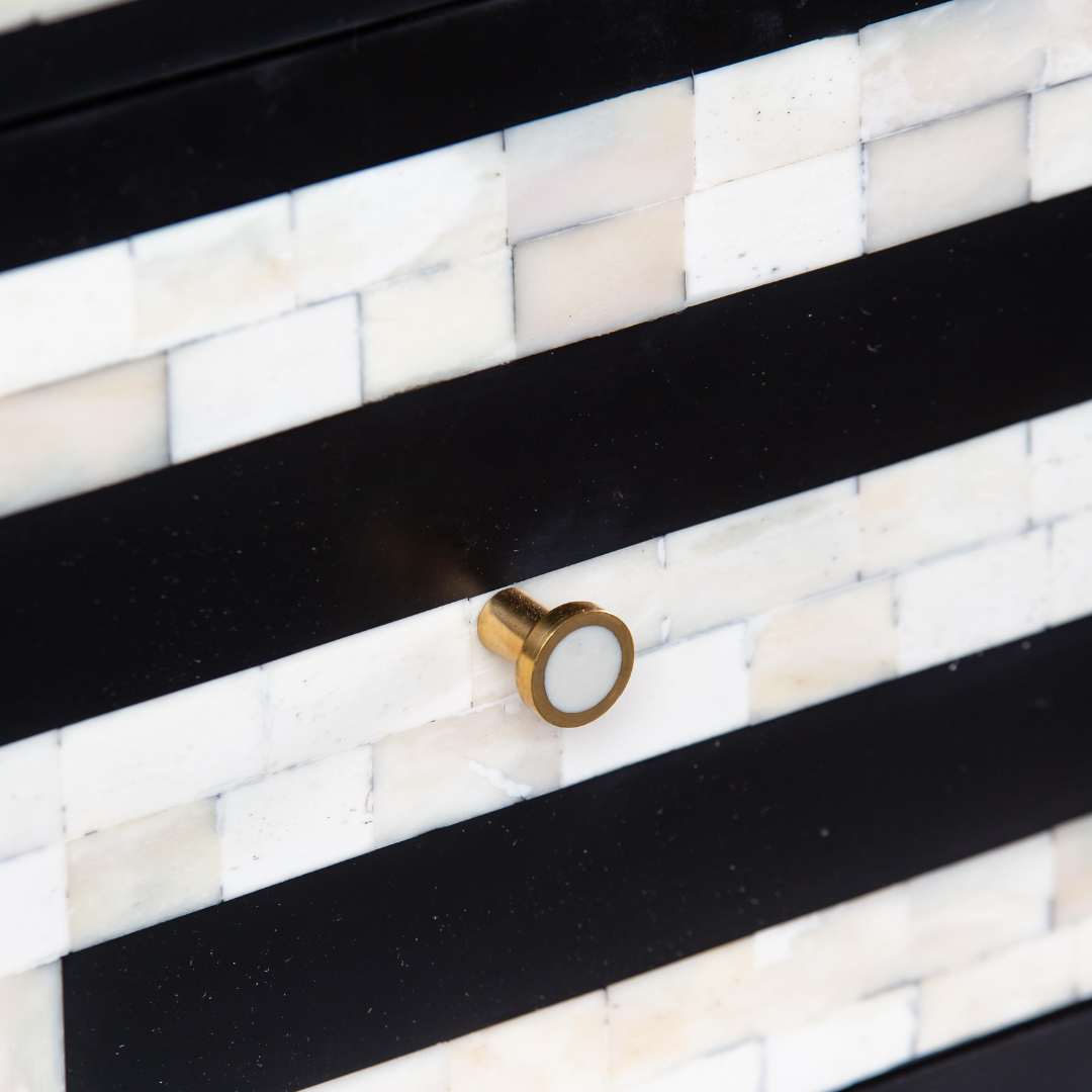 Black bone inlay chest of drawers with curved corners, brass knobs, and maze-inspired geometric design, handcrafted for modern interiors.