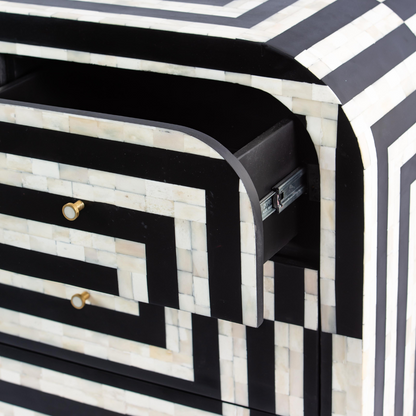 Black bone inlay chest of drawers with curved corners, brass knobs, and maze-inspired geometric design, handcrafted for modern interiors.