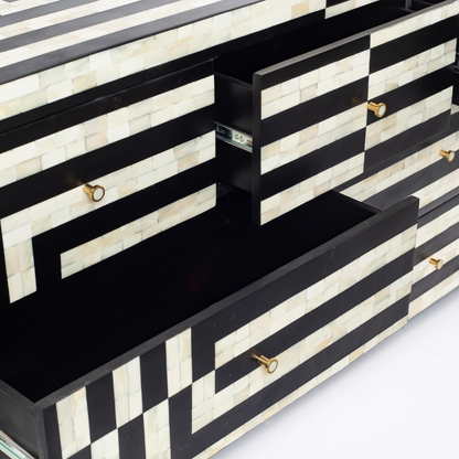 Black bone inlay chest of drawers with curved corners, brass knobs, and maze-inspired geometric design, handcrafted for modern interiors.
