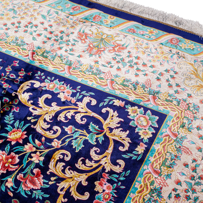 Elegant navy silk rug with detailed floral medallion, ornate cream border, and rich design in gold, coral, and turquoise tones.