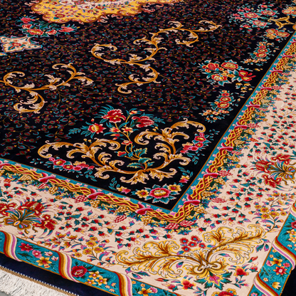 Elegant navy silk rug with detailed floral medallion, ornate cream border, and rich design in gold, coral, and turquoise tones.

