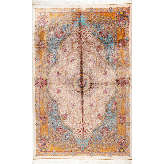 Silk Flow rug with a floral rosette medallion, ivory base, and ornate border in saffron, turquoise, plum, and blush tones.