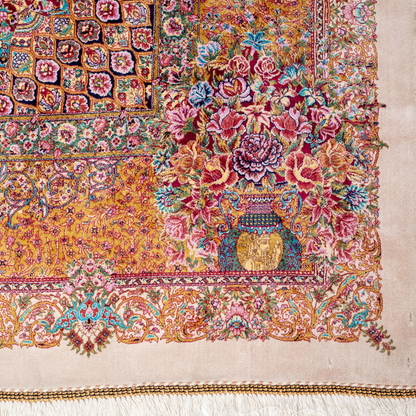 Silk Flow rug with a floral rosette medallion, ivory base, and ornate border in saffron, turquoise, plum, and blush tones.