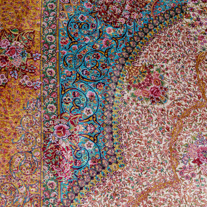 Silk Flow rug with a floral rosette medallion, ivory base, and ornate border in saffron, turquoise, plum, and blush tones.