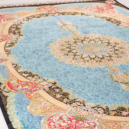 Luxury blue silk rug featuring a detailed central medallion, floral motifs, and ornate bird patterns in gold, coral, and black accents.