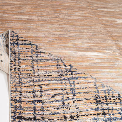 Fray cotton rug in 200x300 cms featuring a beige linear body with abstract navy border, modern and elegant in texture and tone.