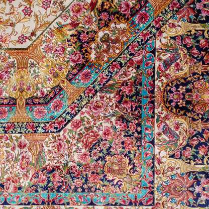 Galeo silk rug featuring central medallion, navy border, and multi-colour floral motifs on an ivory base. Size 150x100 cms.