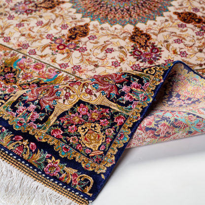 Galeo silk rug featuring central medallion, navy border, and multi-colour floral motifs on an ivory base. Size 150x100 cms.