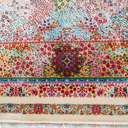 Gohan Silk Rug with intricate floral detailing in red, blue, and pastel tones on an ivory base with turquoise borders, 150x100 cm.