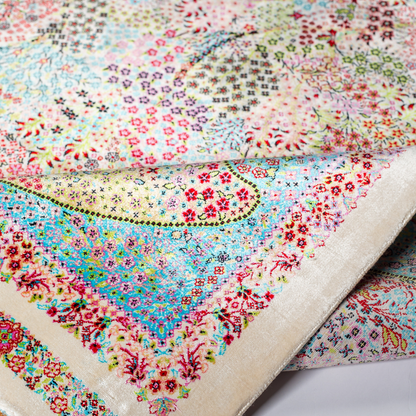 Gohan Silk Rug with intricate floral detailing in red, blue, and pastel tones on an ivory base with turquoise borders, 150x100 cm.