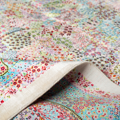 Gohan Silk Rug with intricate floral detailing in red, blue, and pastel tones on an ivory base with turquoise borders, 150x100 cm.