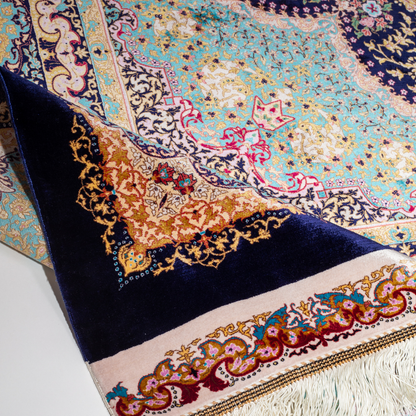 Ilse Silk Rug in 200x300 cm featuring a navy base, turquoise medallion, and intricate floral motifs.