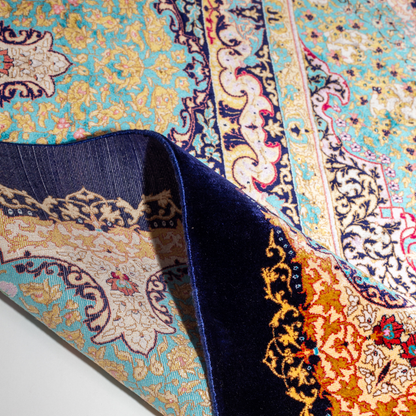 Ilse Silk Rug in 200x300 cm featuring a navy base, turquoise medallion, and intricate floral motifs.